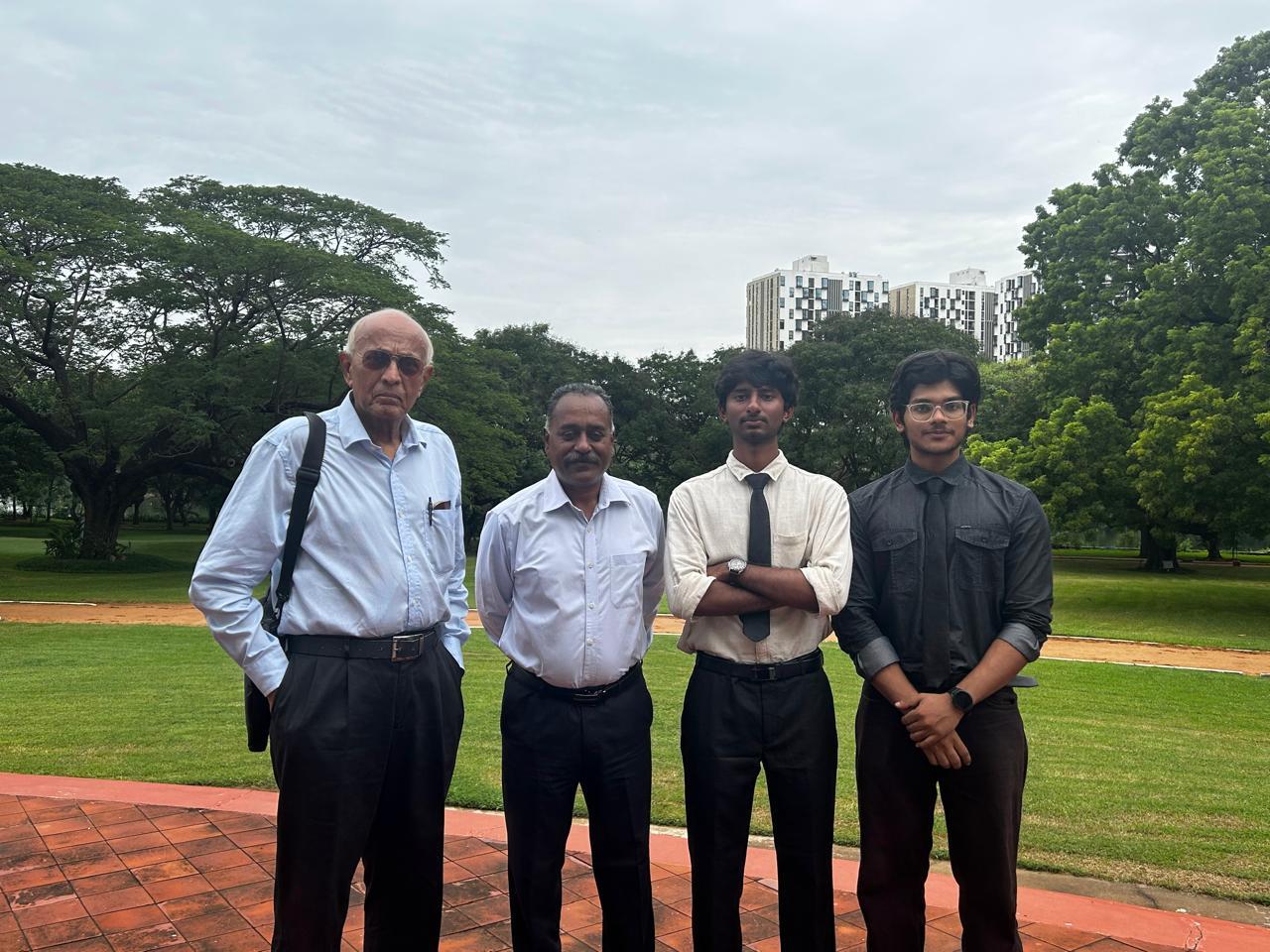 The Mirai team standing outdoors with their mentors